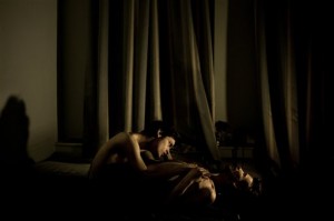 In this photo provided on Thursday Feb. 12, 2015, by World Press Photo, the World Press Photo of the Year 2014 by Mads Nissen, Denmark, for Scanpix/Panos Pictures, shows Jonathan Jacques Louis, 21, and Alexander Semyonov, 25, a gay couple during an intimate moment in St. Petersburg, Russia.  AP PHOTO/MADS NISSEN, SCANPIX/PANOS PICTURES