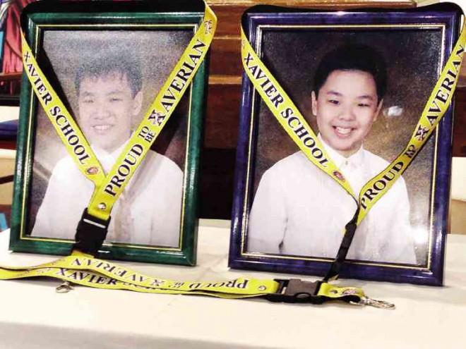PORTRAITS of the Hsieh brothers, on display during the memorial Mass, bear the lanyards that read ‘Proud to be Xaverians.’