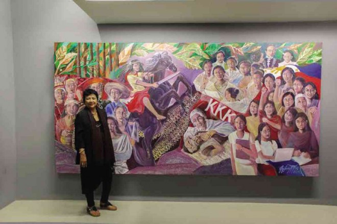 GIGI Javier Alfonso with her mural, “Women Empowerment in the Philippines.” Alfonso also serves as documentarist for the "Siningsaysay" project.