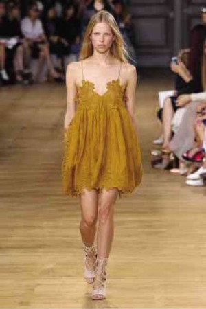 SUMMER lace dress suspended from thin camisole straps is paired with gladiator sandals for Chloé Spring-Summer 2015.