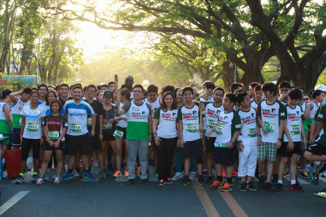 MIIS founding directress Joy Abaquin and MI parent council president Joel Aguada lead the run-by-any-means fun run at the gun start. CONTRIBUTED PHOTO