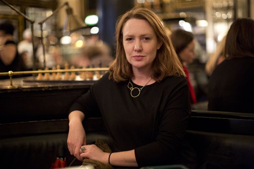 Paula Hawkins, author of "The Girl on the Train", poses for a portrait in London, Thursday, Feb. 19, 2015. The tedium of the daily commute has turned out to be pretty productive for Paula Hawkins. AP