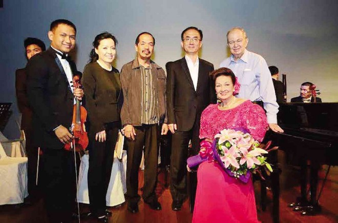 PIANIST Ingrid Sala Santamaria, conductor Juliet Kim, concertmaster Reynaldo Abellana and well-wishers after the successful launching of the Visayas Symphony Orchestra on Jan. 10