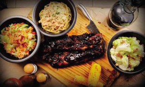 BIG D’s house specialty, Smoked Soft Bone Ribs, with assorted salads