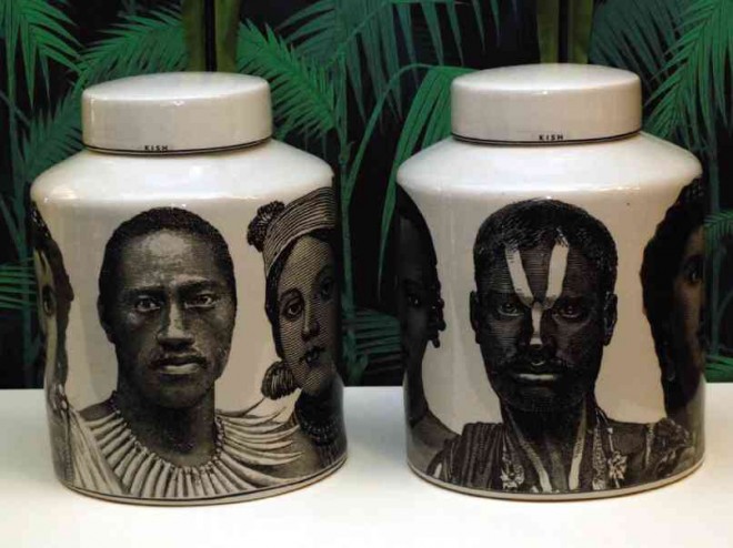TRIBAL faces on ceramic jars from India