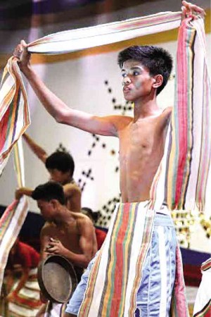 A PERFORMER from La Union Special School for Culture and Arts in Santol, La Union, demonstrates how to wear the bahag or loincloth