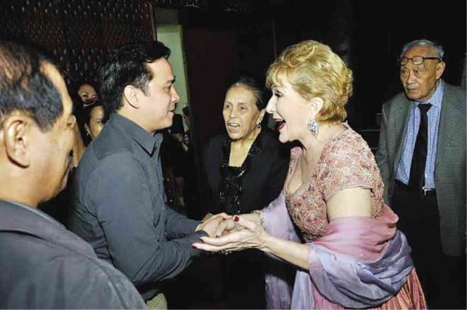 LA MIRICIOIU is greeted by well-wishers— tenor Arthur Espiritu and soprano Irma Potenciano, and Inquirer columnist Amando Doronila.
