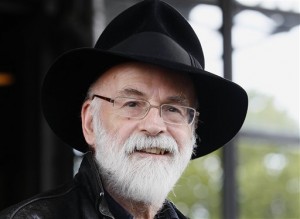 This is a Tuesday, Oct. 5, 2010, file photo of British author Terry Pratchett seen at the Conservative party conference in Birmingham, England. Pratchett, creator of the “Discworld” series, died Thursday March 12, 2015 aged 66.  AP PHOTO/KIRSTY WIGGLESWORTH