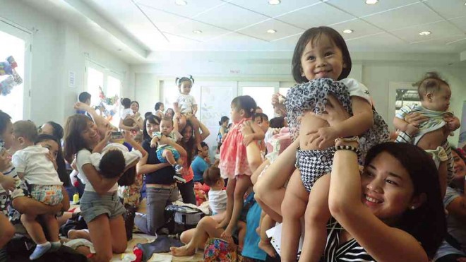 CLOTH DIAPERS CLUB  Parents and guardians belonging to Modern Cloth Nappying Pinays, an online community, raise their babies as soon as they finish changing their diapers during a worldwide event aimed at spreading awareness about cloth diapers.  NASTASHA VERAYO