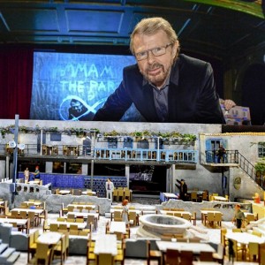 Former ABBA member Bjorn Ulvaeus poses in Stockholm Wednesday April 15, 2015, with a model of his next project - an ABBA-themed entertainment venue in Stockholm, inspired by the Greek taverna in the movie and musical Mamma Mia. The venue, planned to open in January 2016, will be part restaurant, part stage show and part role play with the guests as the stars. AP