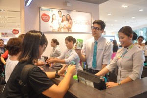 Christian works the cashier at Watsons Mall of Asia