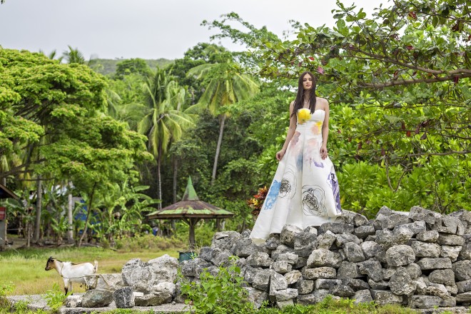 IN THE yard beyond the Punta Cruz ruins in Maribojoc, Pia wears a Rhett Eala hand-painted gown.