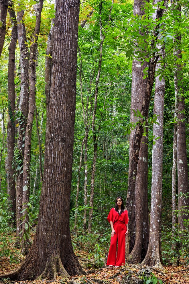 IN THE Bilar man-made forest, Pia’s red Sfera jumpsuit pops out amid the giant mahogany trees. 