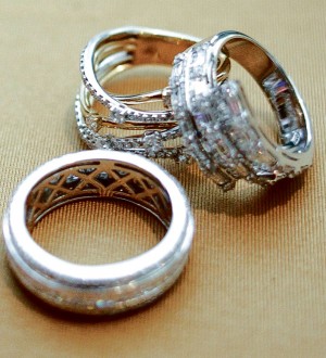 WOMEN buy jewelry to mark milestones. Top right is a ring from the Symphony Collection; bottom and left are Celebration rings.