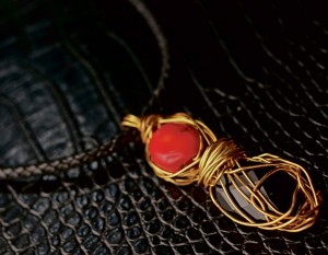 PENDANT combining red coral and onyx strung on a braided leather cord (Photo by Rene Gaviola)