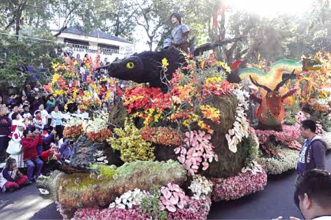 ONE OF THE sixteen participants in the 2015 Grand Float Parade BEAUTIFULLY costumed youth in the flower festival