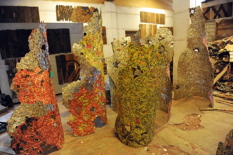 Sculptural works of Professor El Anatsui made with bottle caps at his Nsukka studio on August 8, 2013. The Ghanaian-born Anatsui's first big step toward international acclaim happened in 1990 when he and four others became the first artists from sub-Saharan Africa invited to exhibit at the Venice Biennale, one of the world's most prestigious showcases. His prominence has grown steadily since, including shows in the world's cultural capitals but 1999 is widely seen as a turning point.   AFP 