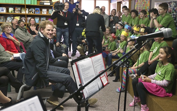 Britain's Prince Harry smiles while visiting Halfmoon Bay school on Stewart Island, New Zealand, Monday, May 11, 2015. The Prince is on the third day of a weeklong tour of the South Pacific. AP
