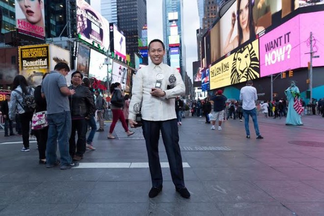 Jhett Tolentino in Times Square with his Tony trophies. PHOTO BY   JHETT TOLENTINO