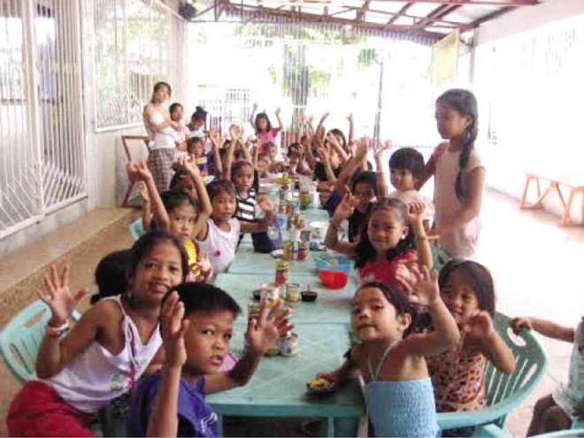 Children in a feeding site at Mapayapa Village, Las Piñas