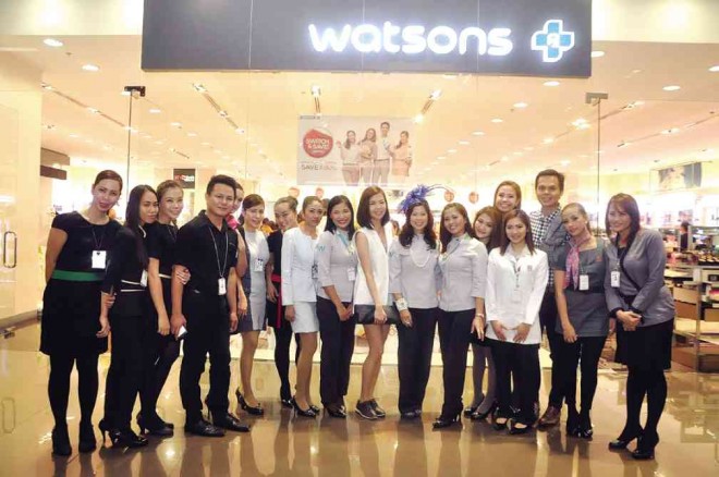 WATSONS SM Aura branch family withWatsons seniormanager for marketing Karen Fabres (next to Sea Princess, left side)