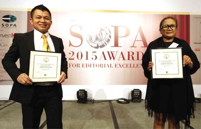 ASIA’S BEST JOURNALISTS Multiawarded Inquirer reporter Nancy Calauor-Carvajal and photojournalist Edwin Bacasmas flash their winning smiles and certificates after being named Journalist of the Year and winner of the Award for Excellence in News Photography, respectively, at the prestigious Society of Publishers in Asia (Sopa) 2015 Awards for Editorial Excellence, which honor the best journalism in the Asia-Pacific region. The awarding ceremonies were held at the Hong Kong Convention and Exhibition Center on Wednesday. JULIET JAVELLANA 