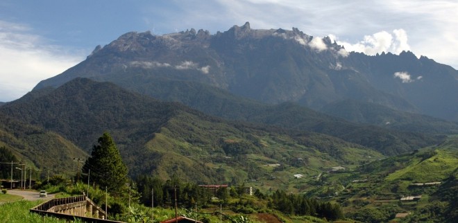 The view of the majestic Mount Kinabalu from the Kundasang town. For a long time now, the mountain has been revered by the people of Kadazan Dusun. - Wikimedia Commons