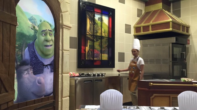 Kids can learn baking a gingerbread man from Gringy in the "Shrek" movie in this pastry house with surprise guests peeking from the door - Shrek and Donkey. Photo by Marc Cayabyab