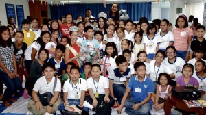 FROM left in the photo, among the children, are 2013 Read-Along Festival Storytelling winner Candy Tan, Sophia School principal Ann Abacan, reigning Miss Philippines-Water Catherine Joy Marin, Miss Philippines-Earth Angelia Ong and Read-Along ambassador Cathy Untalan-Vital. ROMY HOMILLADA