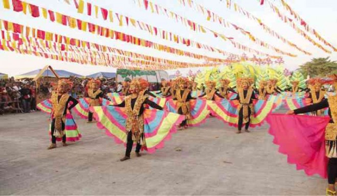 GRAND Champion Barangay Lunao dancers wear coconut costumes with colorful skirts.