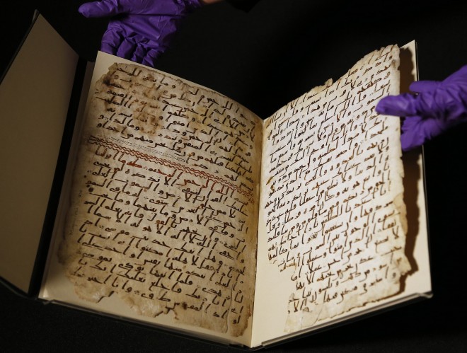 A university assistant shows fragments of an old Quran at the University in Birmingham, in Birmingham central England Wednesday, July 22, 2015. The University of Birmingham said Wednesday that scientific tests prove a Quran manuscript in its collection is one of the oldest known and may have been written close to the time of the Prophet Muhammad. Radiocarbon testing at Oxford University dated the parchment to the time of the prophet, who is generally believed to have lived between 570 and 632. AP 