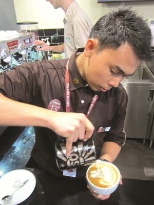 BARISTA Erl Olid prepares a Flat White.