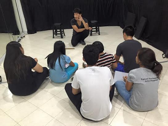 Artist Playground artistic director Roeder Camañag with young theater talents from Pamantasan ng Lungsod ng Valenzuela. PHOTO FROM ARTIST PLAYGROUND