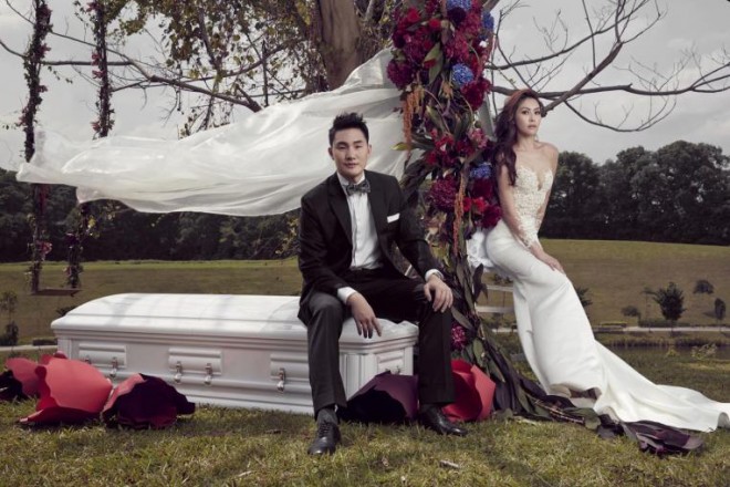 Their lives are inextricably linked to their profession so Jenny Tay and Darren Cheng decided on wedding photos featuring a casket as a prop. PHOTO: JENNY TAY