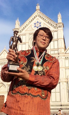 FIDEL Calalang holds the Golden David trophy