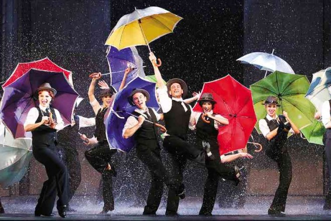 A FEAST for the senses! The cast kicks up a storm with multi-colored umbrellas. HAGEN HOPKINS