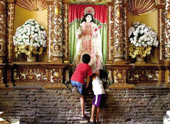 KAWIT Church’s pretty patroness attracts the young.