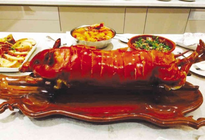 NOTE the wooden “lechon” tray. COURTESY OF IMELDA TAN