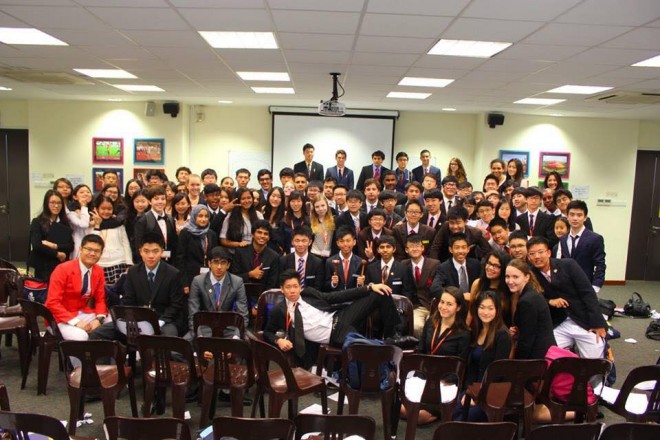 JAN WYNTON Sy (holding gavel) with the rest of the delegates to the Model United Nations in Singapore