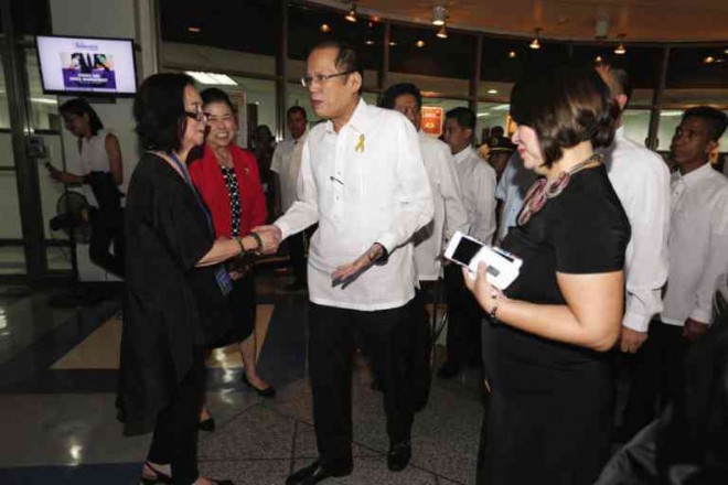 PRESIDENT Aquino being greeted by INQUIRER chairMarixi R. Prieto (in red) and editor in chief Letty Jimenez-Magsanoc