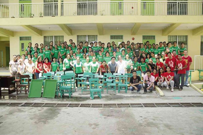 VOLUNTEERS from Starbucks Philippines and staff from Teach for the Philippines at the Malaban Elementary School in Biñan, Laguna. In front of them are some of the school chairs they fixed and repainted.