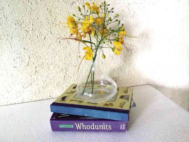 STACK a vase on books.