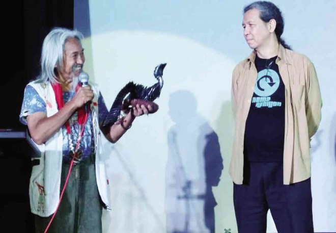 KIDLAT Tahimik, aka Eric de Guia, receives special award from Teddy Co, NCCA National Committee on Cinema officer.