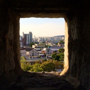 The modern-day Suwon City, as viewed from the centuries-old Hwaseong Fortress.