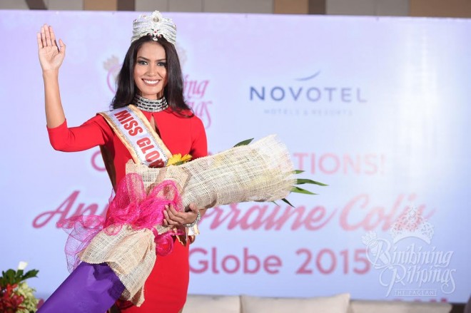 Ann Lorraine Colis waves to the crowd upon her return to the Philippines after winning the crown at the Miss Globe 2015 pageant in Toronto, Canada. 