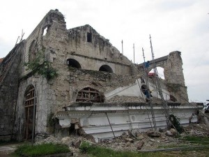WORKERS tear down pediment of Loay Church. IVAN HENARES