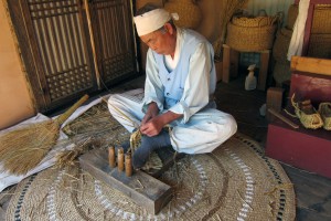 WEAVING traditional Korean shoes at the Korean Folk Village.