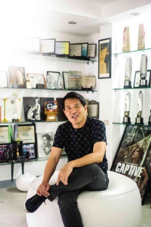 BRILLANTEMendoza in the living room of hisMandaluyong house, amid trophies and plaques that attest to his triumph as a filmmaker in the international film-festival circuit. ELOISA LOPEZ