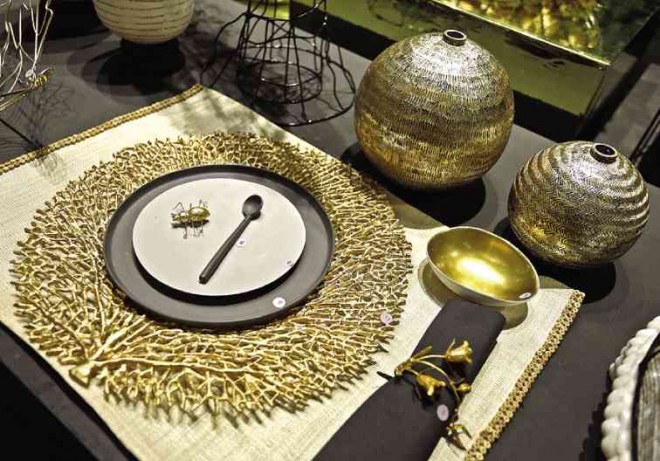 TABLE setting is a play on black and metallic pieces.