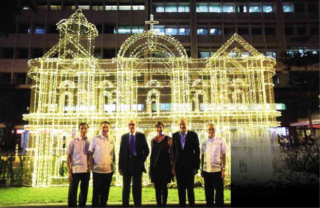 THE HOLIDAY season is on as Christmas lights in the form of a church brighten Ayala Avenue in Makati. Ayala Corp. officials Dave Balangue, Bobby Dy, Jaime Zobel de Ayala, Patricia Zobel, Fernando Zobel de Ayala and Manny Blas attend the ceremony.